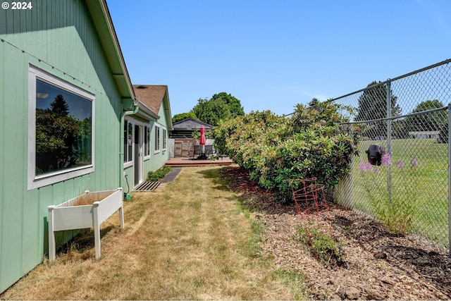 view of yard featuring a wooden deck