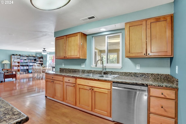 kitchen with dishwasher, ceiling fan, sink, and light hardwood / wood-style flooring