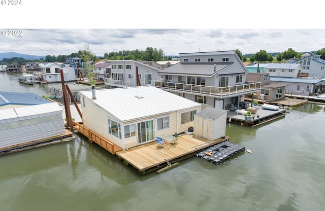 dock area featuring a water view and cooling unit