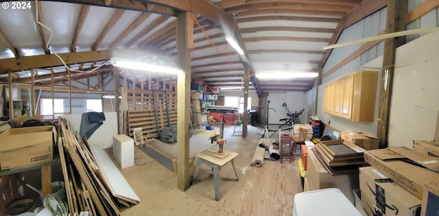 misc room featuring vaulted ceiling, healthy amount of natural light, and light wood-style floors