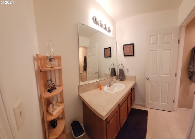 bathroom featuring tile patterned flooring and vanity