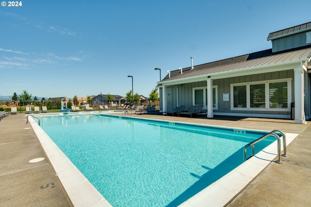 view of swimming pool with a patio area