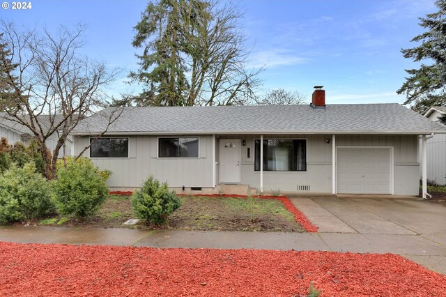 ranch-style house featuring a garage