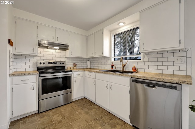 kitchen with white cabinetry, sink, tasteful backsplash, and stainless steel appliances