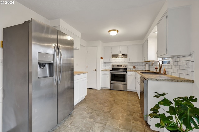 kitchen featuring appliances with stainless steel finishes, sink, white cabinets, and decorative backsplash