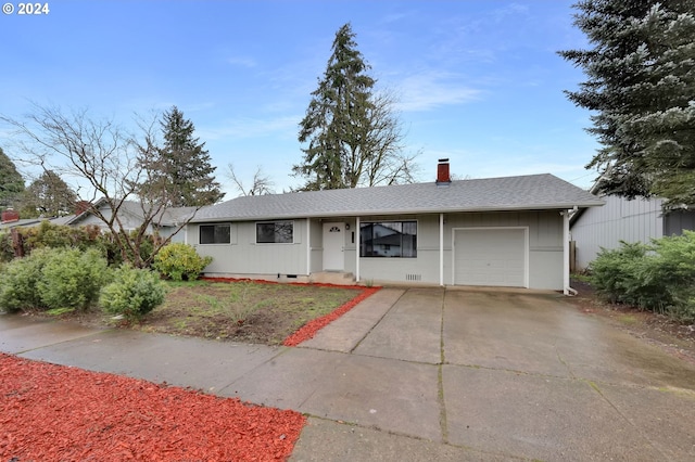 single story home featuring a garage