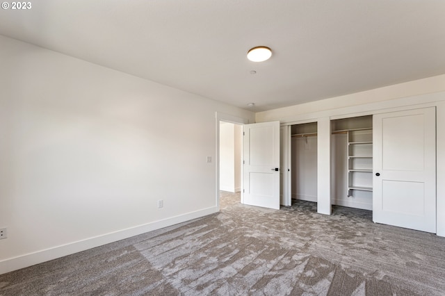 unfurnished bedroom with carpet floors