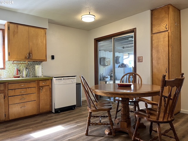 46791 Winfrey Rd, Westfir, OR 97492 - dining room featuring dark wood-style flooring, healthy amount of natural light, and baseboards