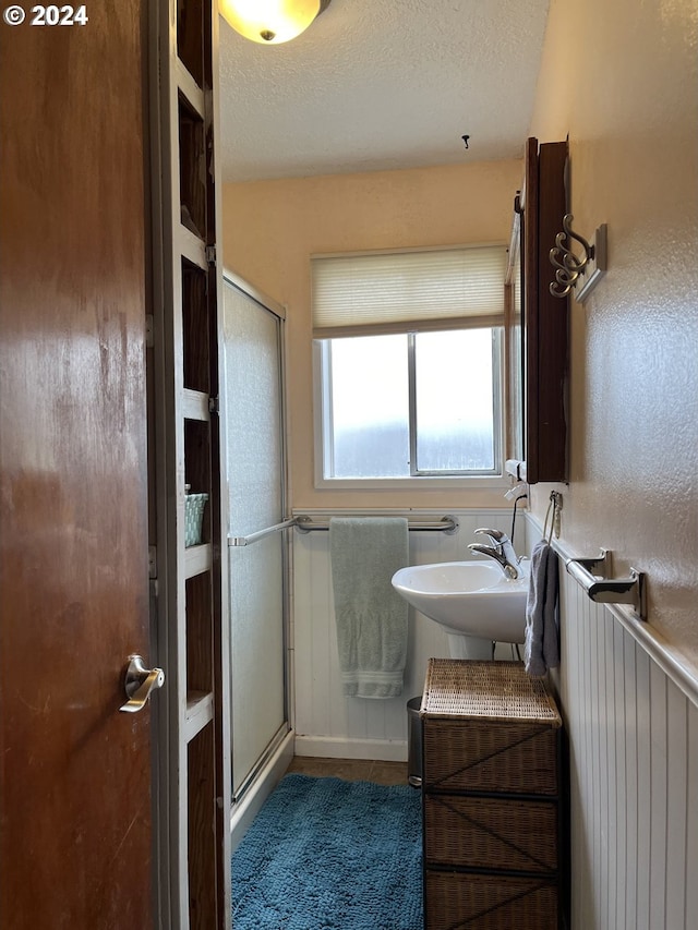 46791 Winfrey Rd, Westfir, OR 97492 - full bathroom with a stall shower, a sink, and a textured ceiling