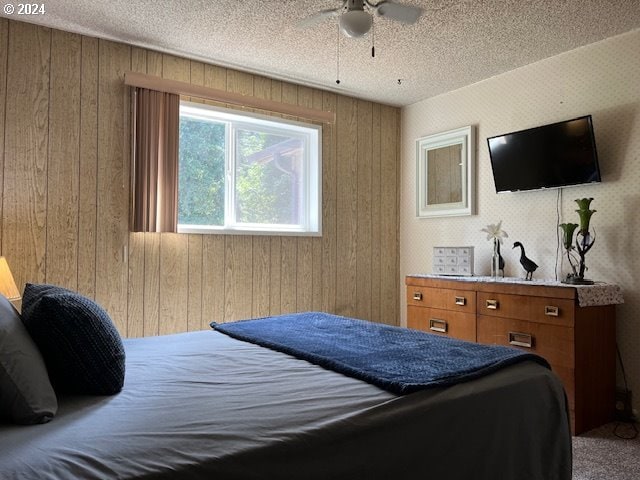 46791 Winfrey Rd, Westfir, OR 97492 - bedroom featuring wood walls, carpet, and a textured ceiling