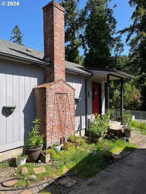 46791 Winfrey Rd, Westfir, OR 97492 - doorway to property with a chimney and roof with shingles