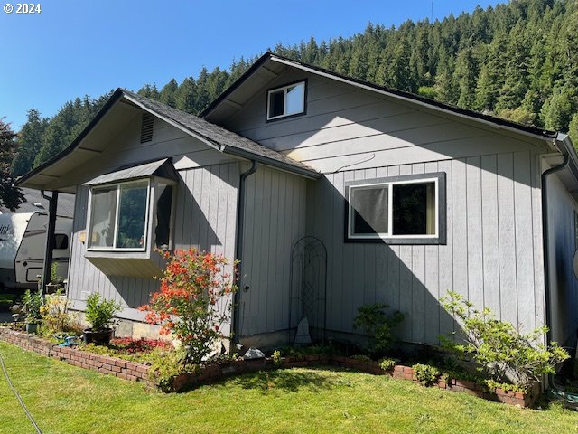 46791 Winfrey Rd, Westfir, OR 97492 - view of front of home with a forest view and a front lawn
