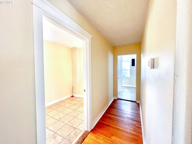 hall with light hardwood / wood-style floors