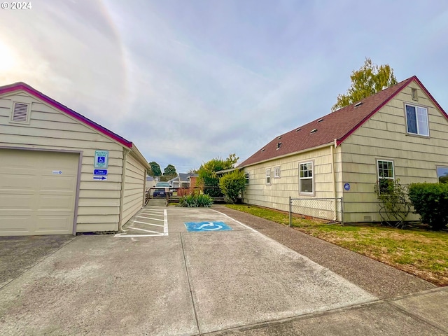 view of side of home featuring a garage