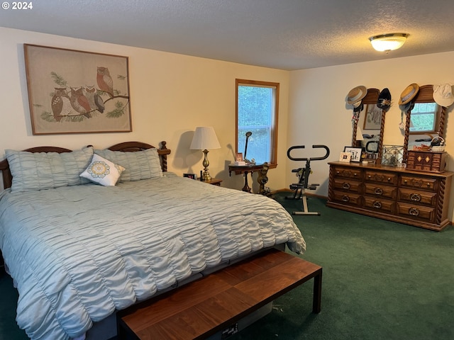 carpeted bedroom featuring a textured ceiling