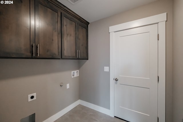 washroom featuring gas dryer hookup, hookup for a washing machine, cabinets, and hookup for an electric dryer