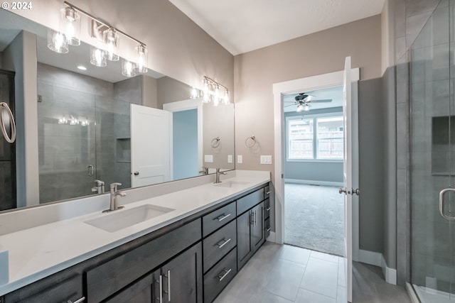 bathroom featuring an enclosed shower, vanity, tile patterned flooring, and ceiling fan