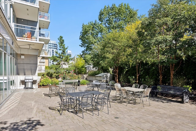 view of patio / terrace with a balcony and area for grilling