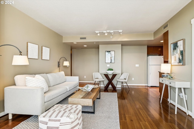 living room featuring dark hardwood / wood-style flooring