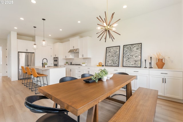 15044 SW 164th Ave Unit L17, Tigard, OR 97224 - dining space with recessed lighting, a chandelier, and light wood-style floors