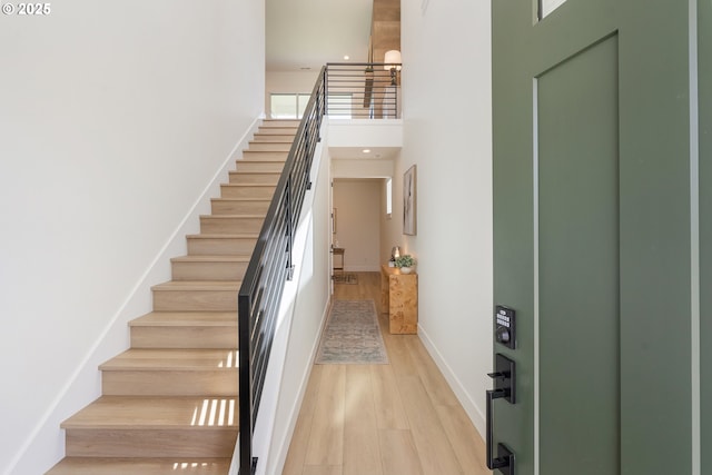 15044 SW 164th Ave Unit L17, Tigard, OR 97224 - stairs with wood finished floors and a high ceiling