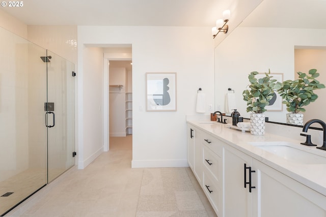 15044 SW 164th Ave Unit L17, Tigard, OR 97224 - full bathroom with double vanity, a shower stall, and a spacious closet