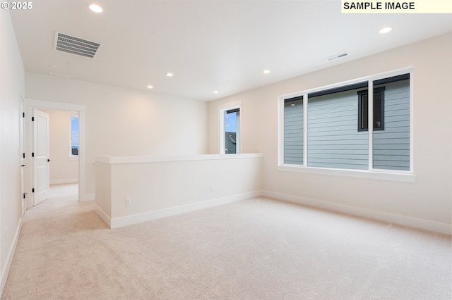 unfurnished room featuring visible vents, recessed lighting, and carpet floors