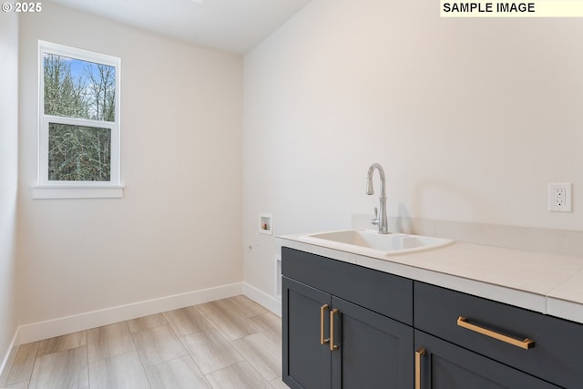 interior space featuring vanity and baseboards