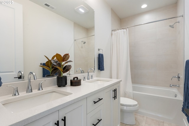 15044 SW 164th Ave Unit L17, Tigard, OR 97224 - bathroom with shower / bath combo, double vanity, tile patterned flooring, and recessed lighting