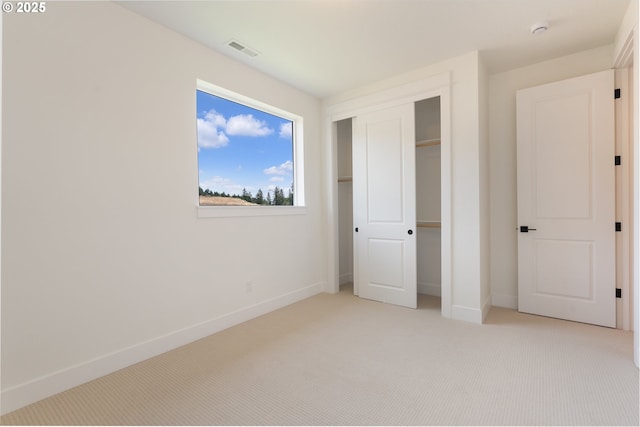 15044 SW 164th Ave Unit L17, Tigard, OR 97224 - unfurnished bedroom featuring light carpet and a closet