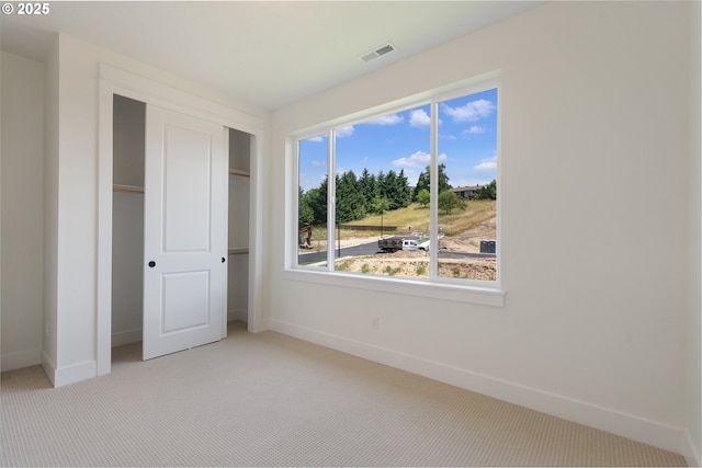 15044 SW 164th Ave Unit L17, Tigard, OR 97224 - unfurnished bedroom featuring light colored carpet and a closet