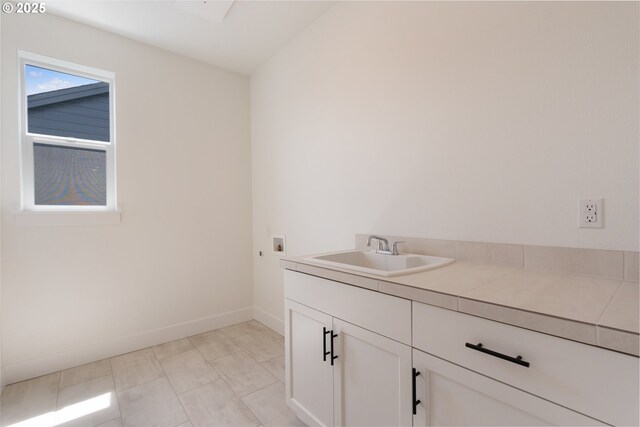 15044 SW 164th Ave Unit L17, Tigard, OR 97224 - washroom featuring washer hookup and cabinet space