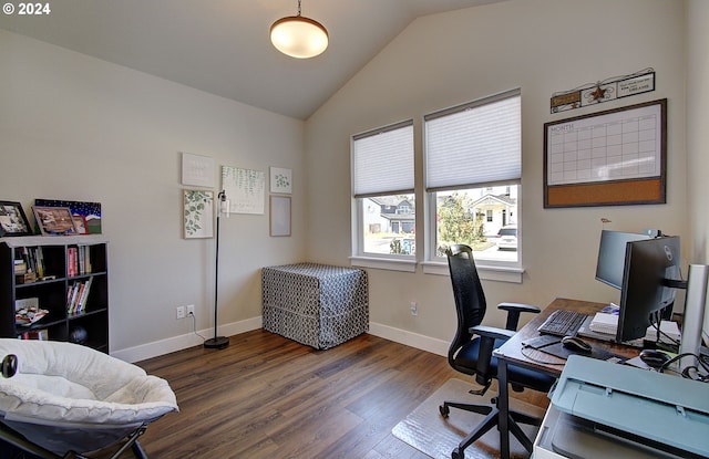 home office with dark wood-type flooring and lofted ceiling