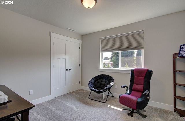 living area with carpet flooring