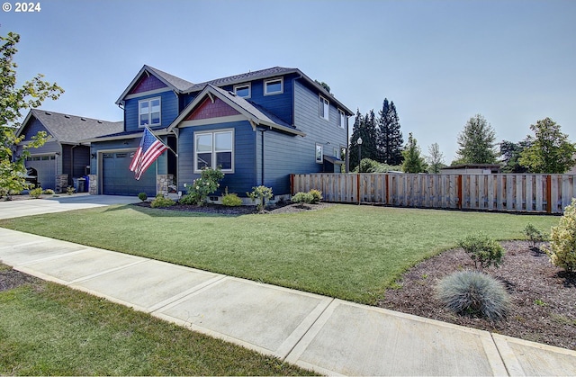 view of front of property featuring a garage and a front yard