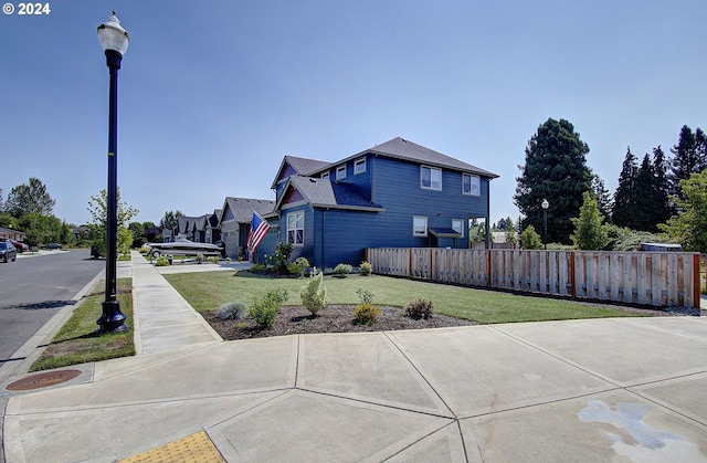 view of property exterior with a yard