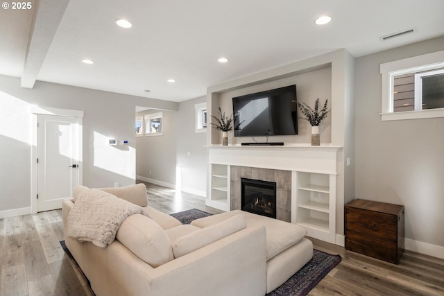 living room featuring a fireplace and hardwood / wood-style floors