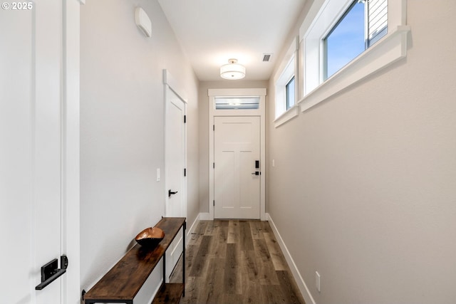 entryway with dark hardwood / wood-style floors