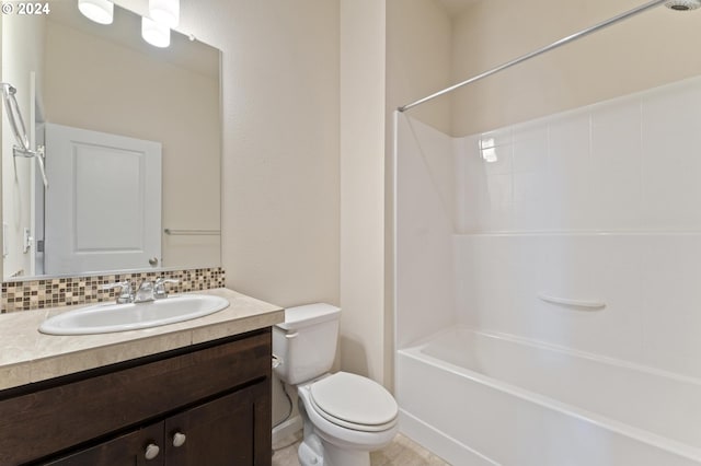 full bathroom with backsplash, tile patterned floors, bathing tub / shower combination, vanity, and toilet