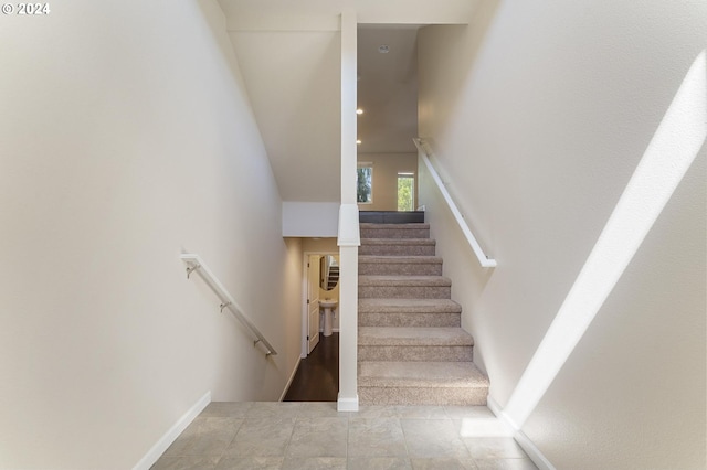 stairs with tile patterned flooring