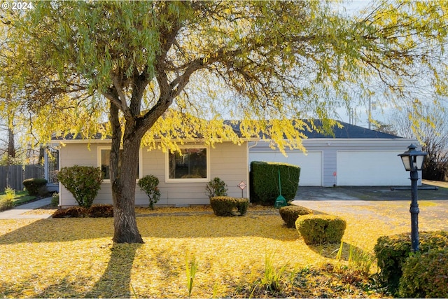 single story home featuring a garage