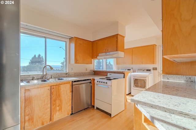 kitchen featuring white range, sink, stainless steel dishwasher, light wood-type flooring, and separate washer and dryer