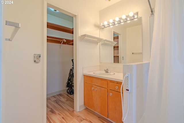 bathroom featuring vanity and hardwood / wood-style flooring