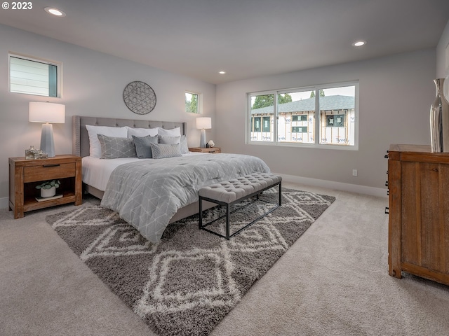 bedroom featuring light colored carpet