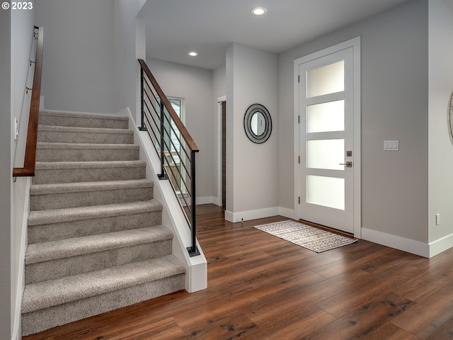 foyer entrance featuring dark wood-type flooring