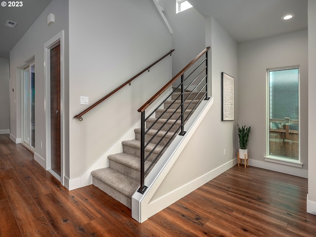 staircase featuring hardwood / wood-style floors