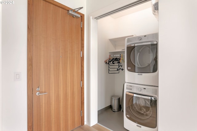 laundry area with stacked washer / dryer