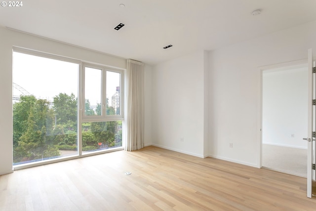 empty room with light wood-type flooring