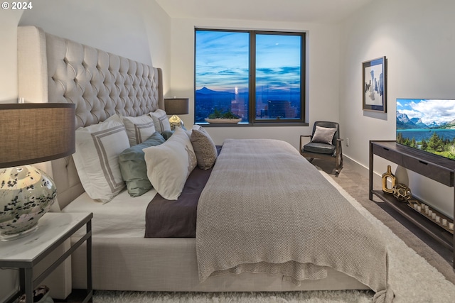 carpeted bedroom featuring baseboards