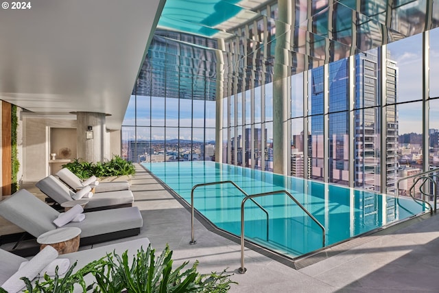 view of swimming pool featuring a city view